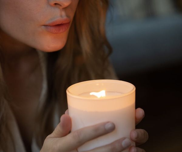 Close-up of a person's hands in a meditative gesture, showing concentration.